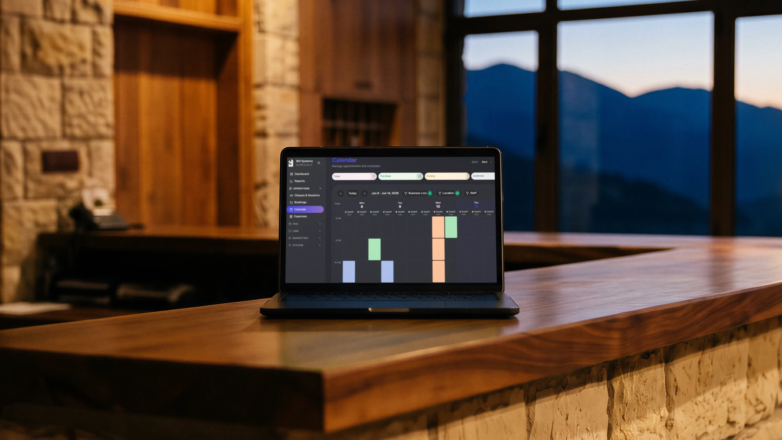 BDI Systems' booking calendar on a laptop at the reception counter of a mountain lodge
